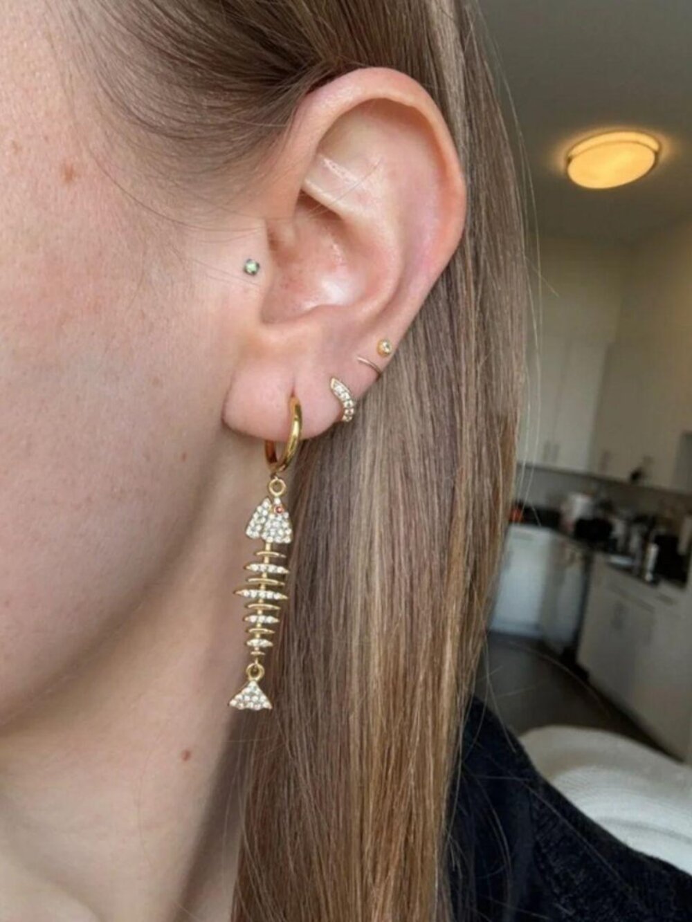 The Tiffany Cz studded Gold Fish Charm Hoop Earrings stainless steel